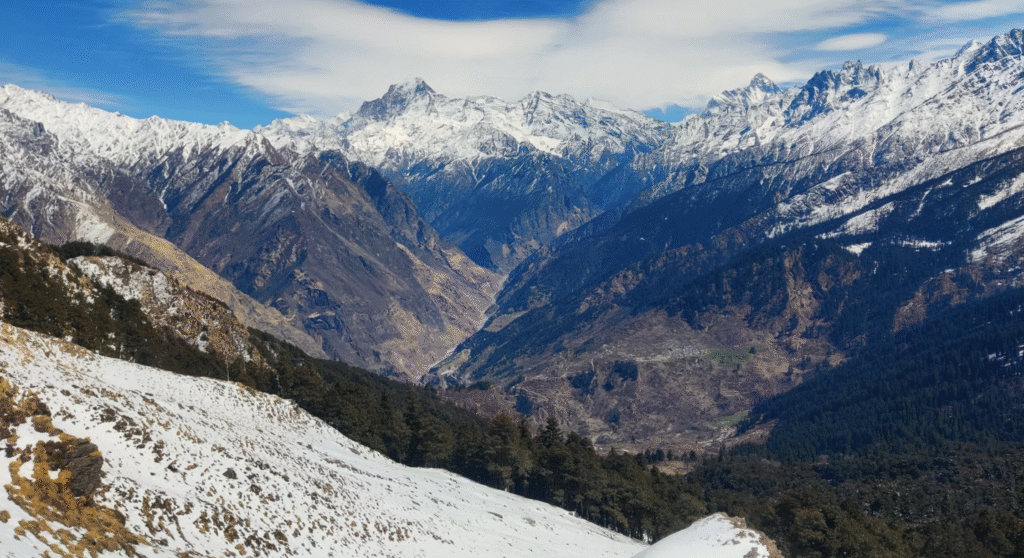 Pangarchulla Peak Trek summit with snow and Himalayan views, themountaintrekker